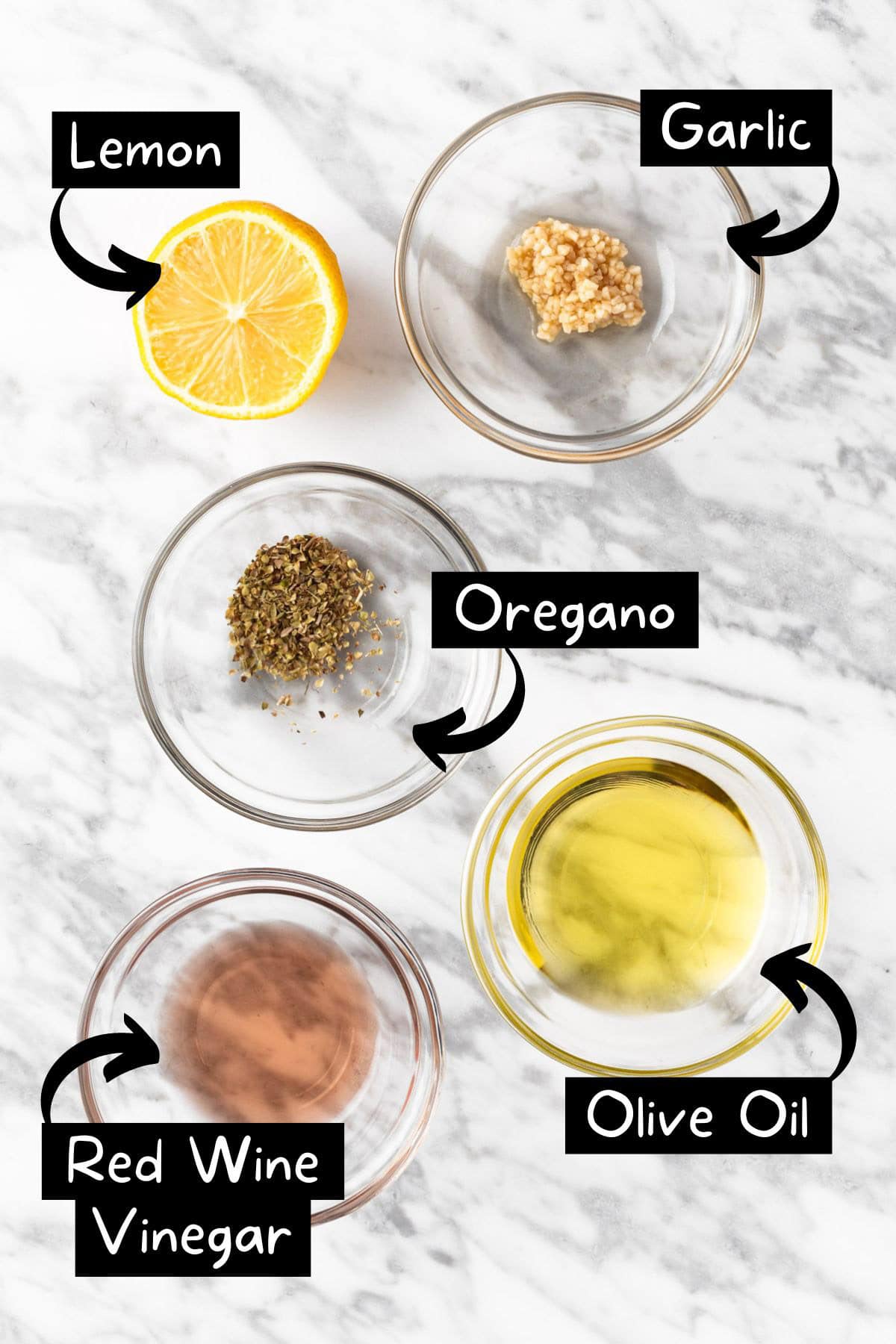 The ingredients needed to make the lemon oregano vinaigrette.
