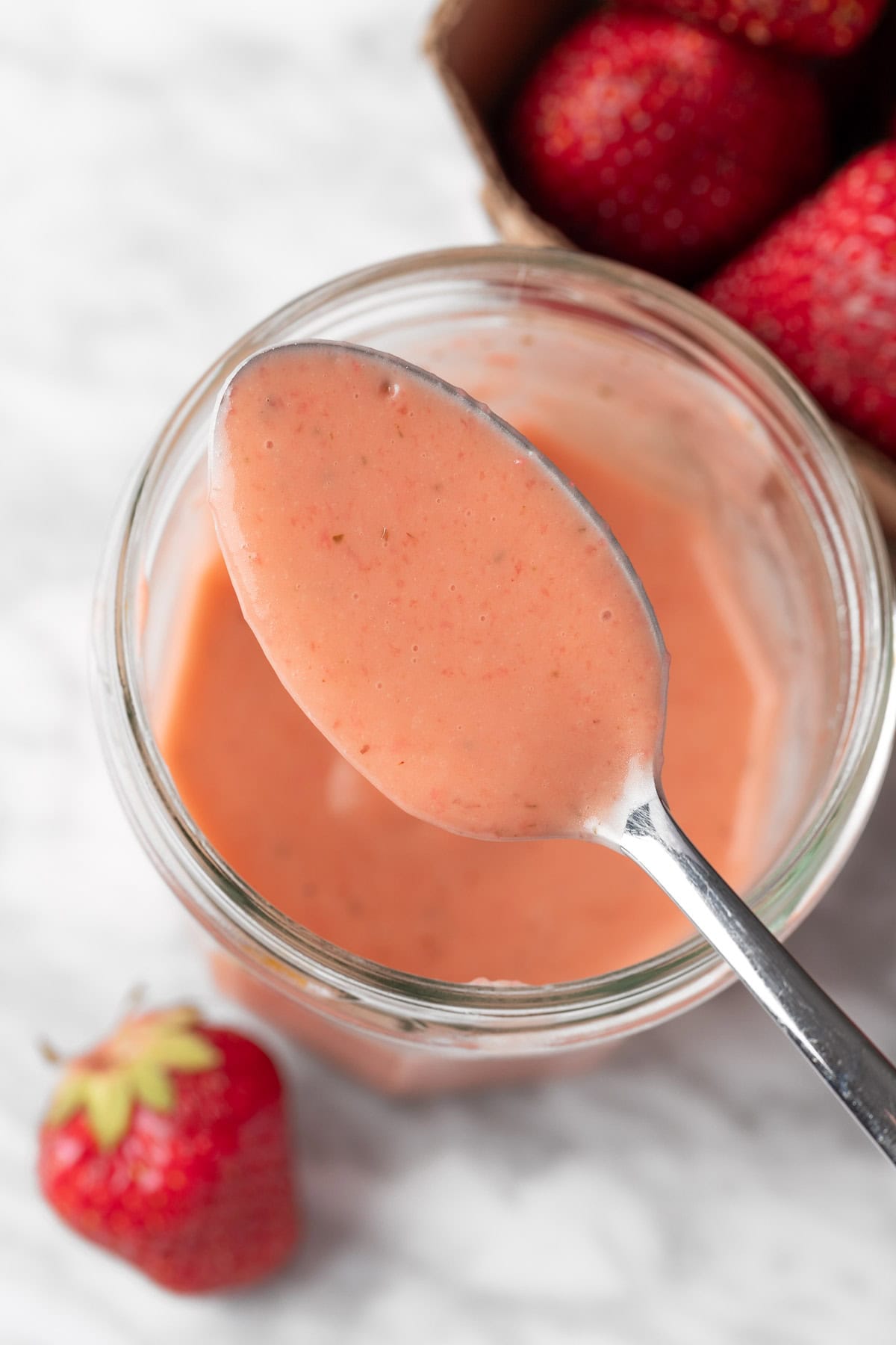 A spoonful of strawberry basil vinaigrette dressing.