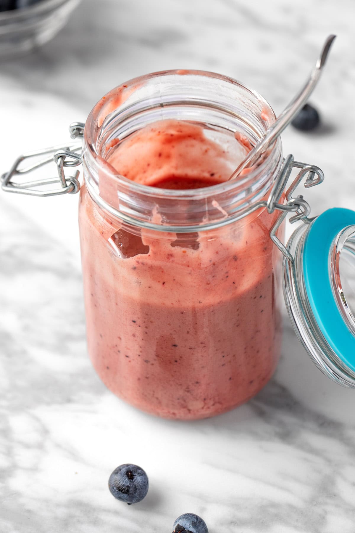 Blueberry vinaigrette dressing in a glass jar.