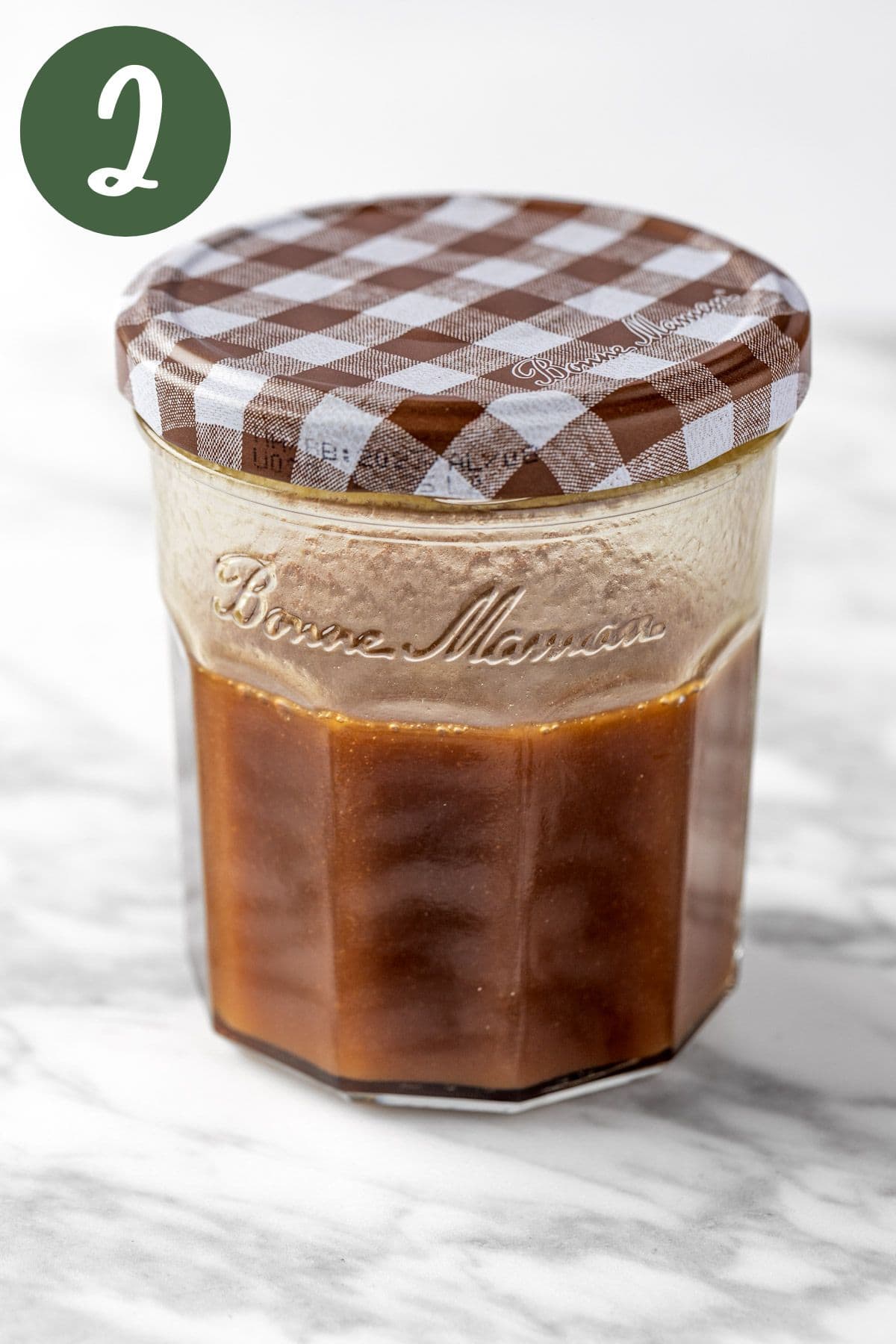 The maple vinaigrette dressing mixed together in a mason jar.