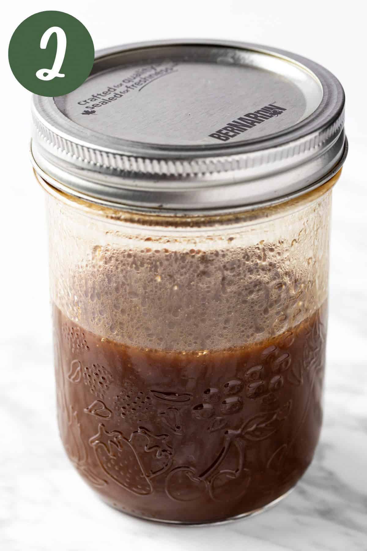 Vinaigrette ingredients emulsified in a mason jar.