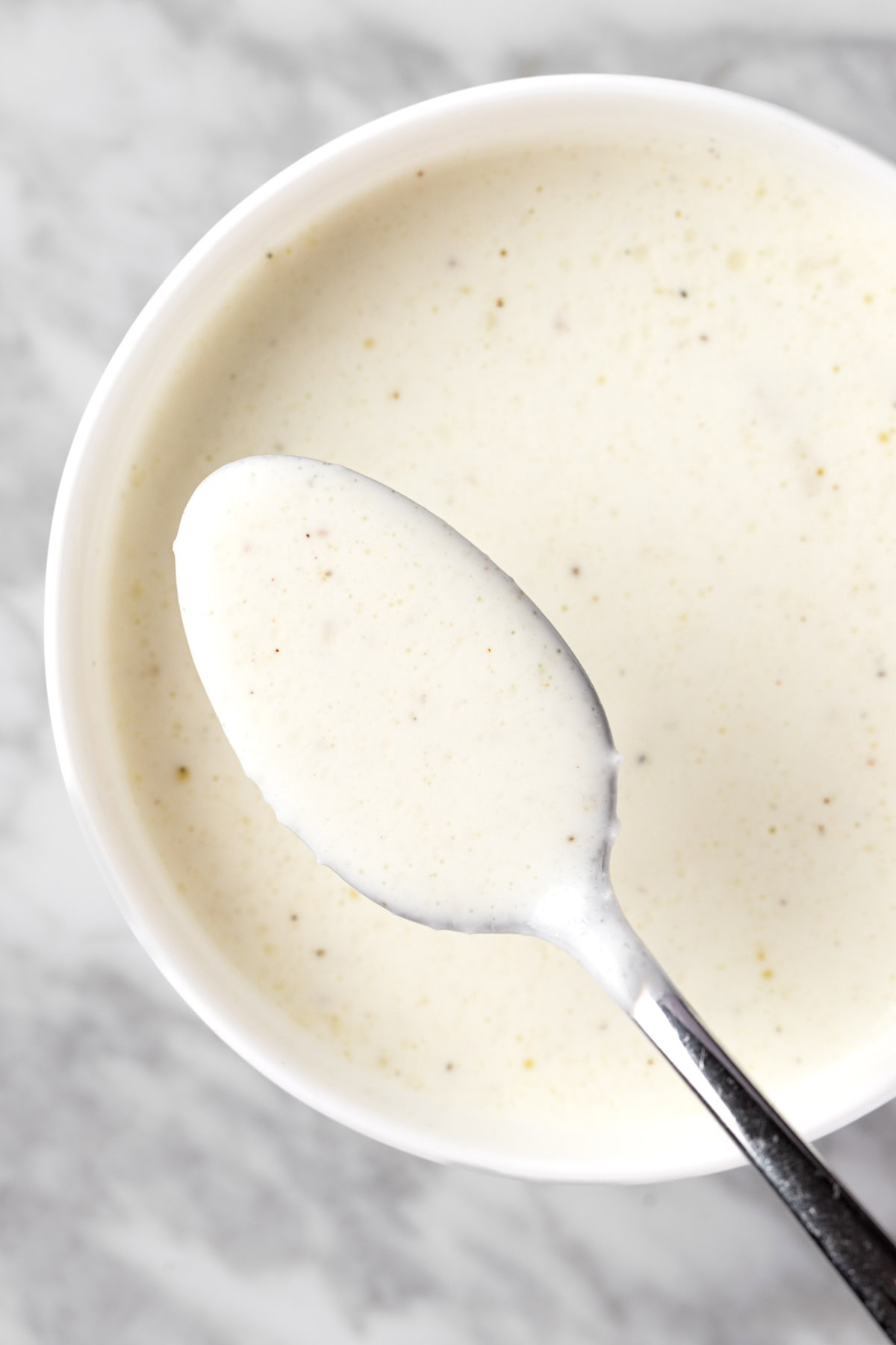 A spoonful of tzatziki salad dressing.