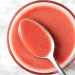 Overhead view of a spoonful of cherry balsamic vinaigrette.