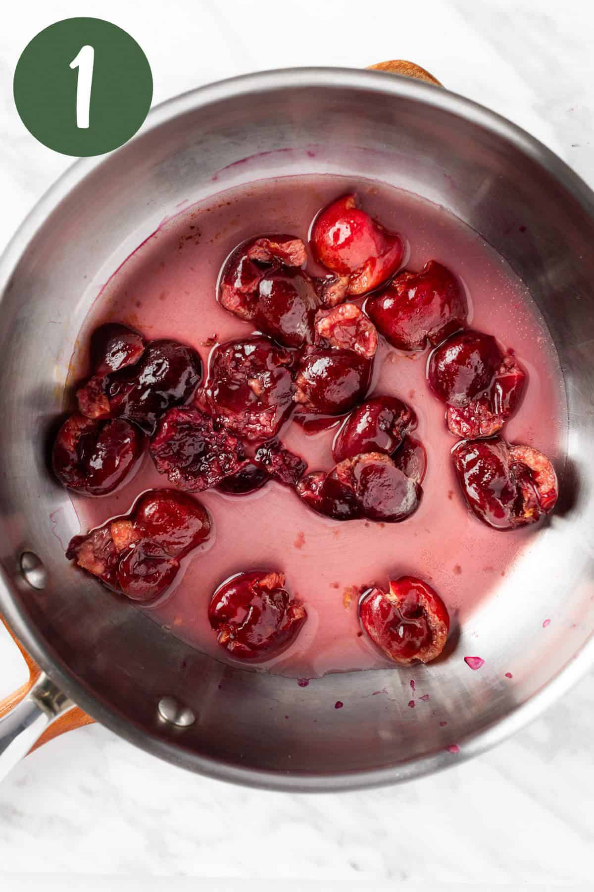 The cherries being heated in a saucepan.