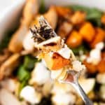 An up close photo of a forkful of Sweetgreen’s Harvest Bowl salad.