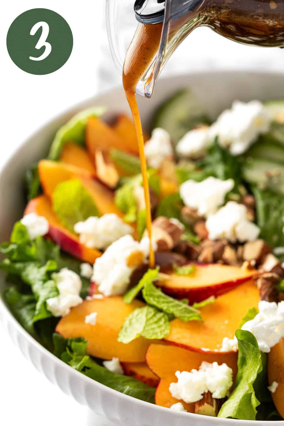 Pouring the balsamic vinaigrette dressing on top of the salad.