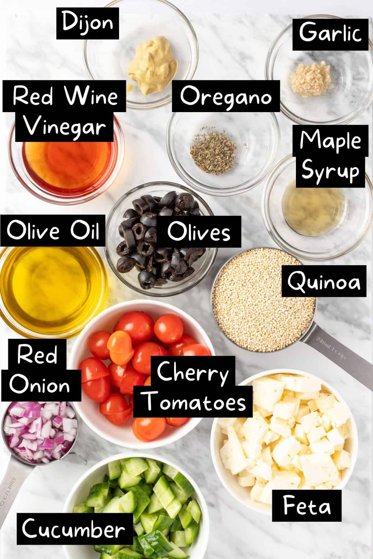 The ingredients needed to make the Greek Quinoa Salad.