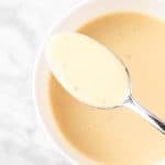 An overhead view of a spoonful of Lemon Tahini Dressing.