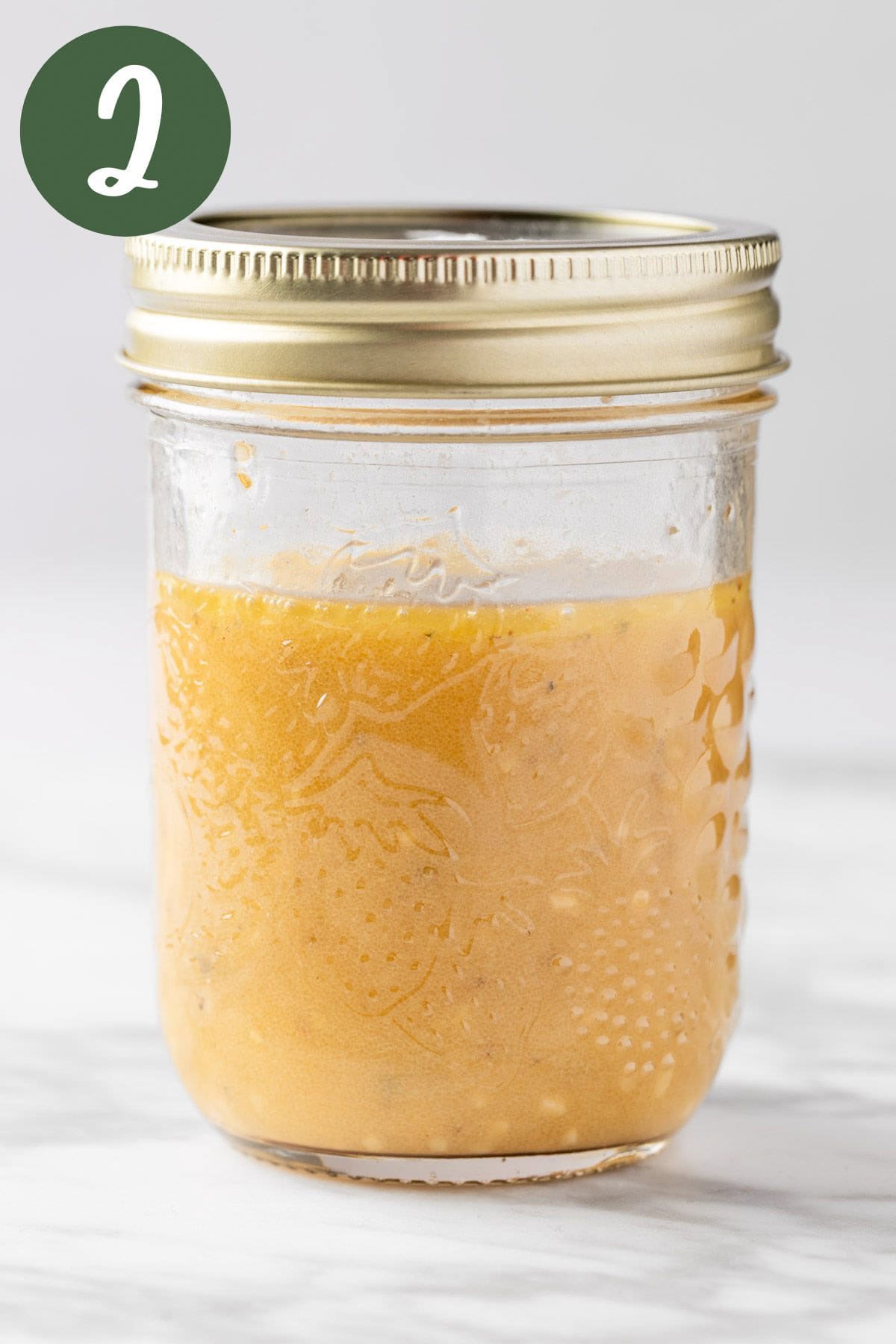 The creamy red wine vinaigrette mixed together in a mason jar.