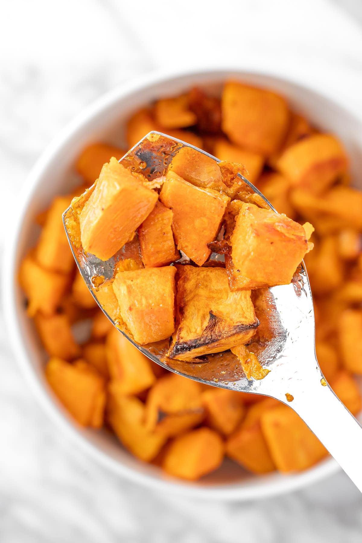 A close up spoonful of Sweetgreen sweet potatoes.