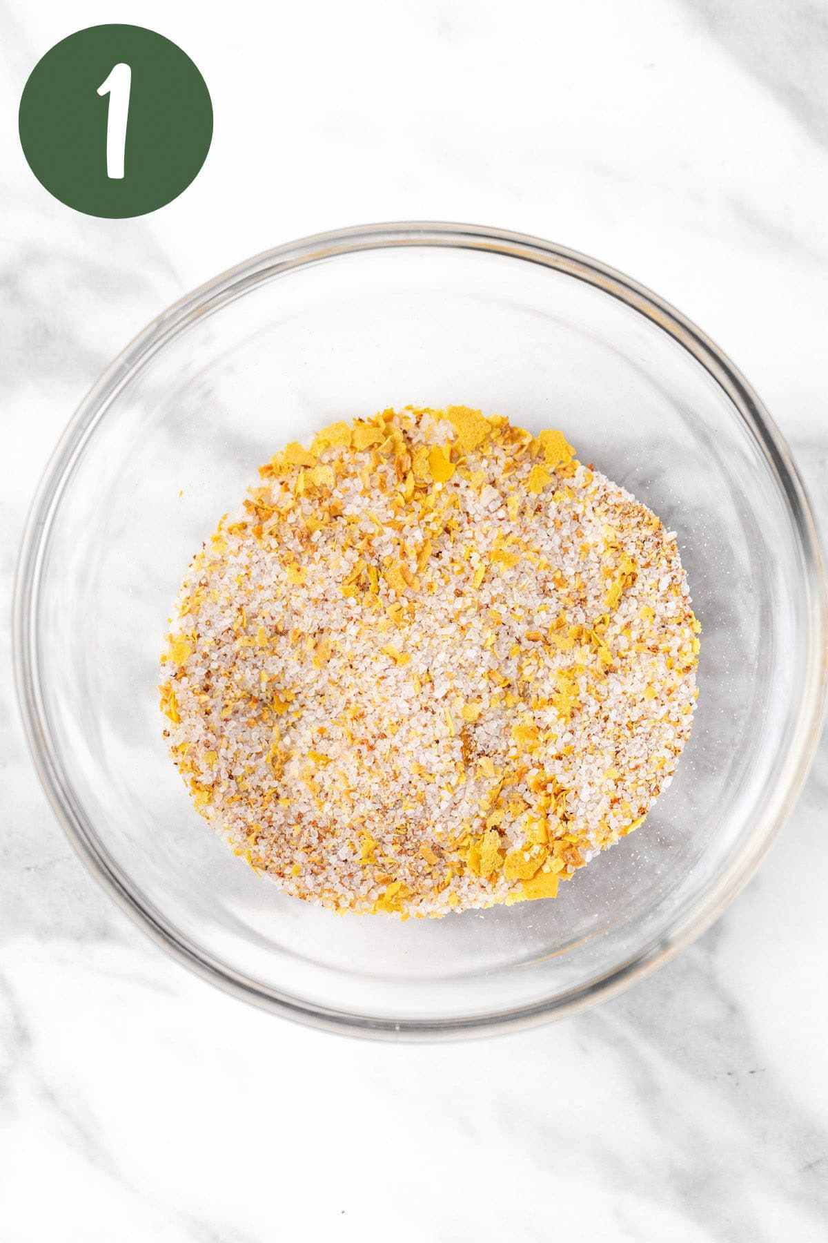 The umami seasoning ingredients mixed together in a small glass bowl.