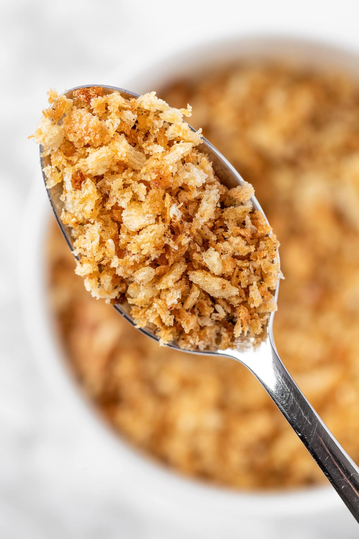 An up-close view of a spoonful of za’atar bread crumbs.