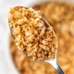 An up-close view of a spoonful of za’atar bread crumbs.