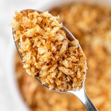 An up-close view of a spoonful of za’atar bread crumbs.