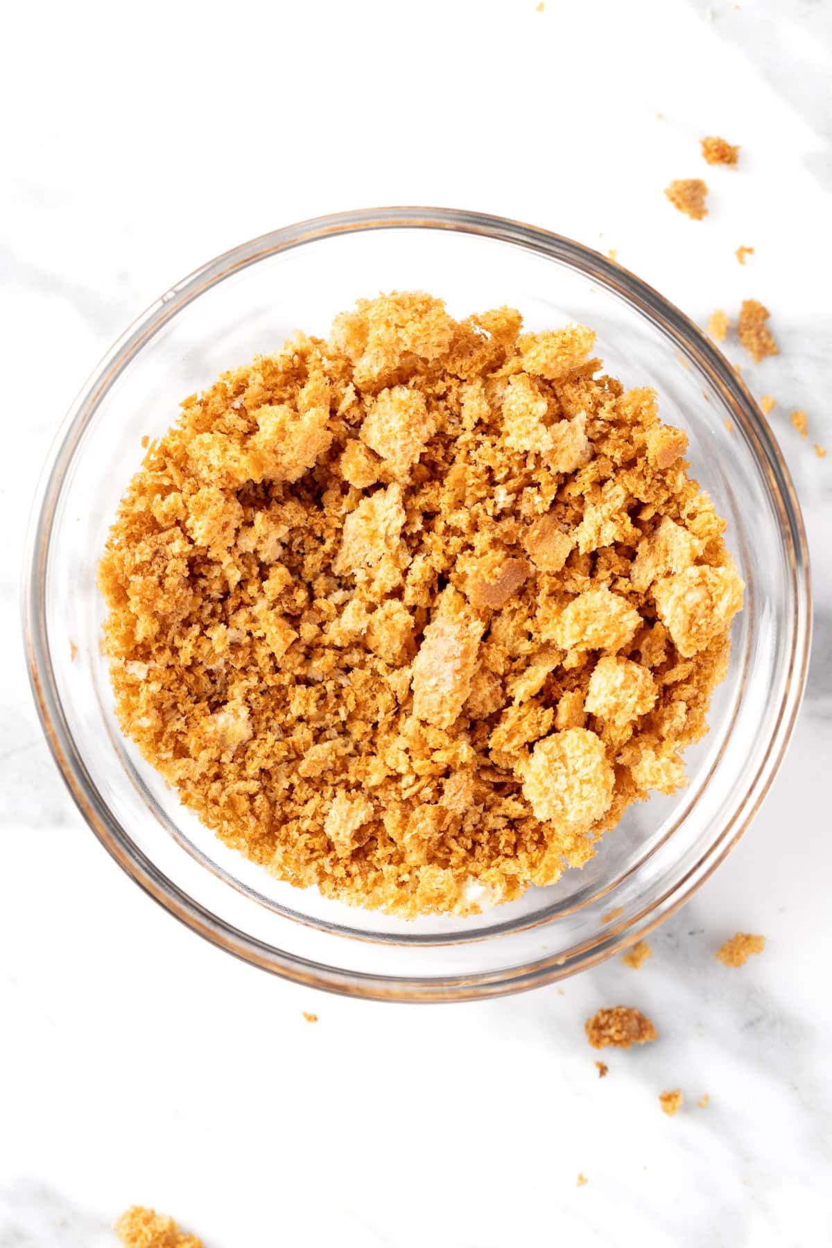 A small bowl of garlic bread crumbs.